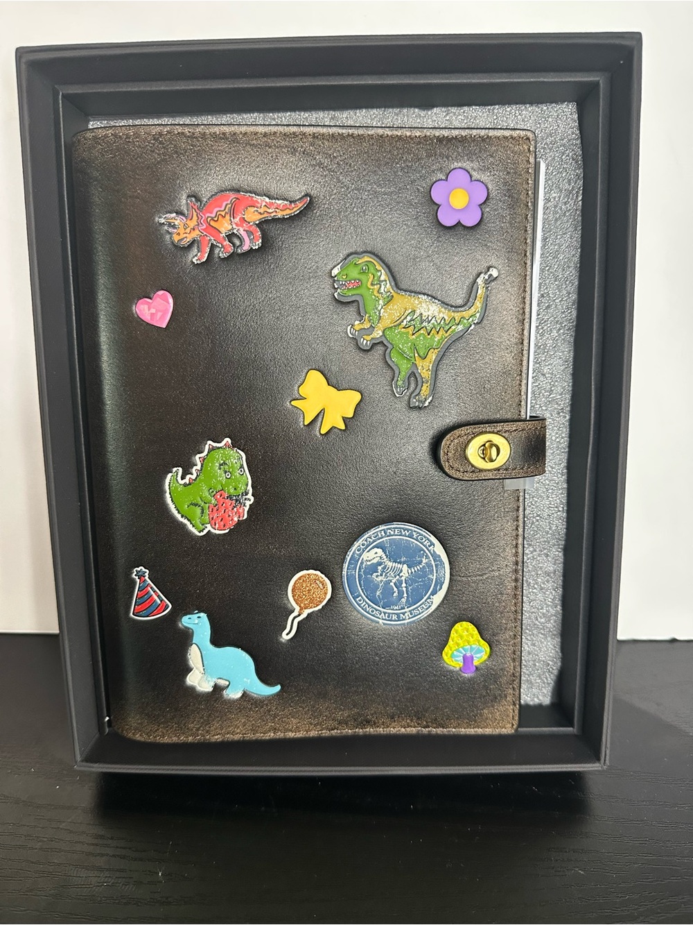 Coach Rexy 10th Birthday Notebook
In Loved Leather With Sticker Print